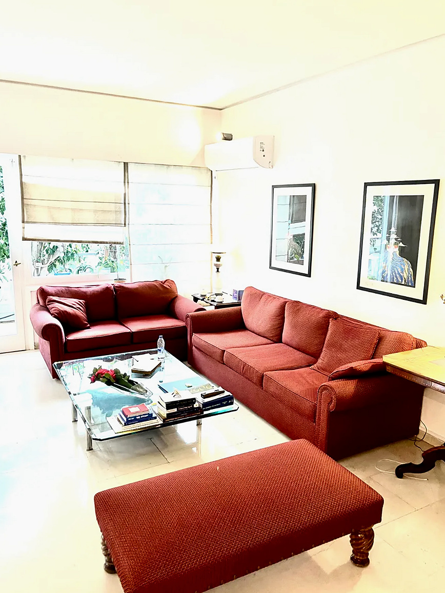 Sunlit living room of the Kolonaki apartment